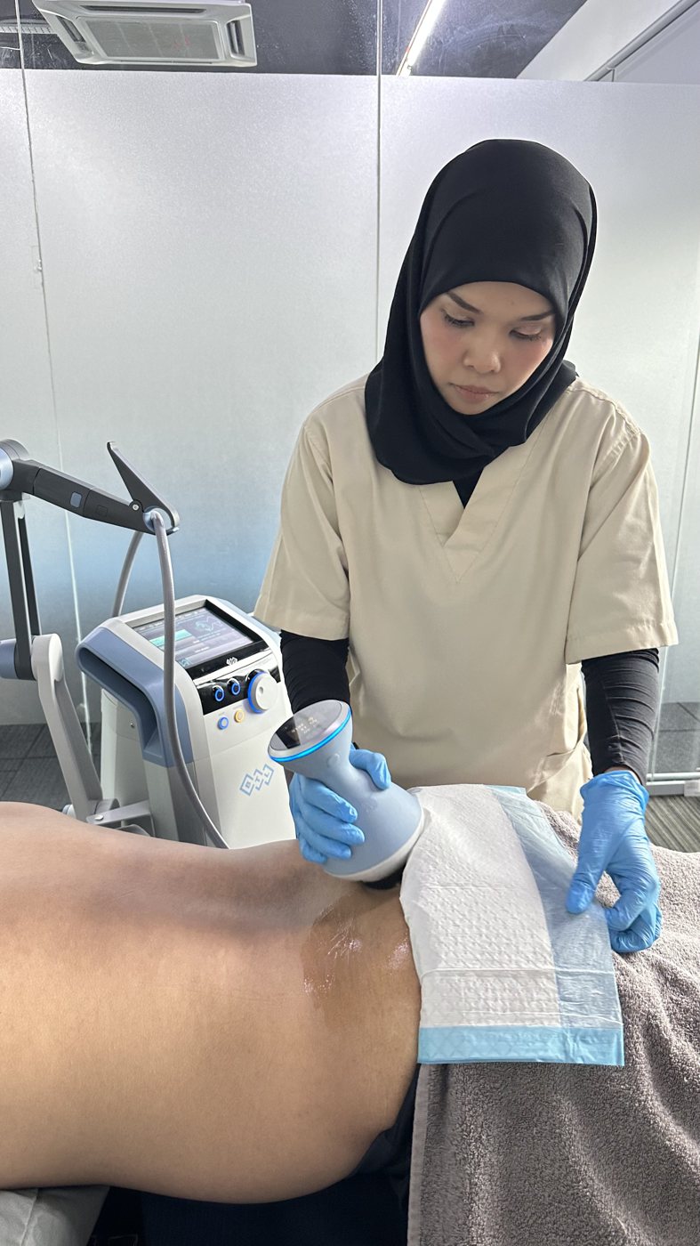 Focused shockwave therapy being delivered to a patient's knee